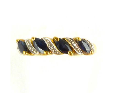 A 9ct gold ring set with four diagonal marquise cut sapphires, separated by five diagonal rows of tiny diamond chips in white