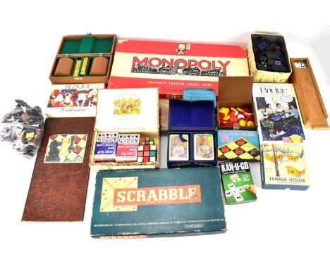 A large collection of vintage boardgames to include Monopoly, Dominoes, Bridge, various other card games and packs of cards, 