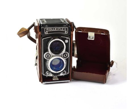 ROLLEIFLEX; a 3.5 E2 medium format film camera, fitted with a Schneider-Kreuznach Xenotar 1:3.5/75 taking lens, with leather 