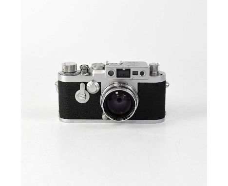 LEICA; a IIIg 35mm rangefinder camera, serial number 849932, fitted with a Summitar f=5cm 1:2 lens and maker's cap.Condition 