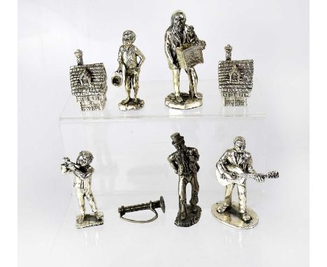 Five plated musician figures comprising a guitarist, an organ grinder with monkey, a young boy playing the flute, a boy colle
