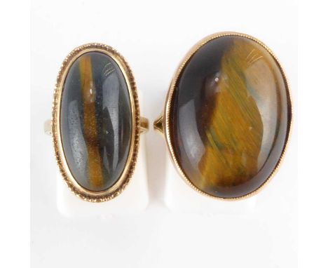 Two 9ct gold tiger's eye rings, the largest 2.5 x 2cm, ring size P, the other 2.2 x 1.3cm, size J, combined approx. 15.1g (2)