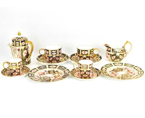 ROYAL CROWN DERBY; a twelve-piece porcelain part tea/coffee service, in Imari pattern and gilt decorated, possibly pattern no