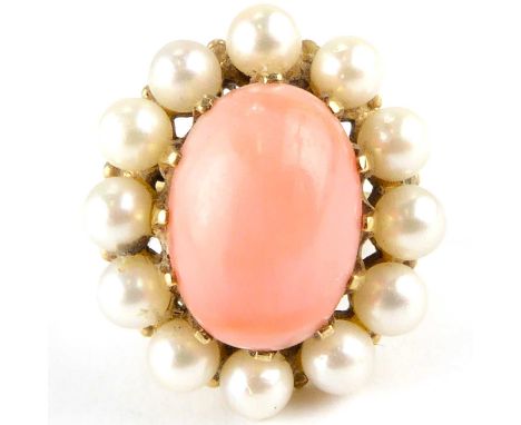 A 9ct gold dress ring with claw set centred coral bead within a border of seed pearls, size L, approx. 6.3g.Condition Report: