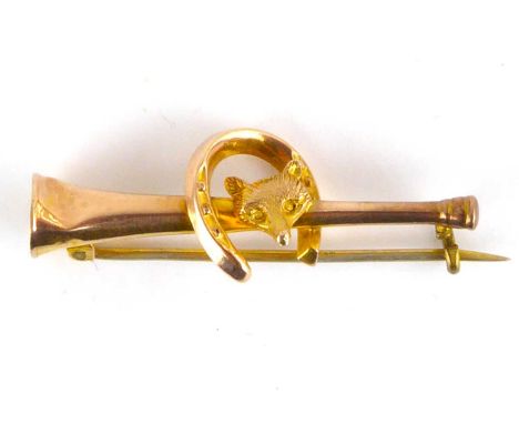 A 9ct gold bar brooch in the form of a hunting horn, with fox head and horseshoe, length 3.7cm, approx. 1.4g.Condition Report