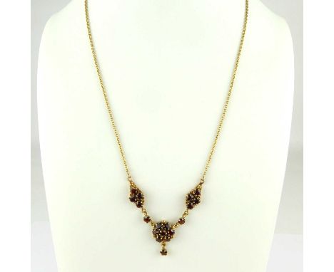 A 9ct gold claw set garnet cluster necklace on 9ct gold dainty chain with ring clasp, length 42cm, approx. 6.5g.