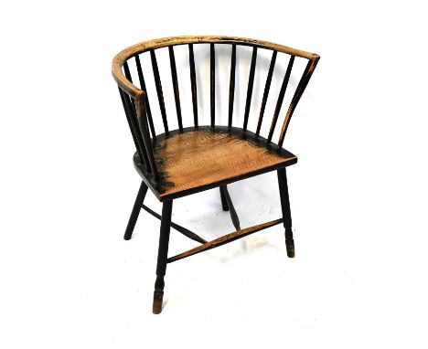 A 19th century elm stick back bowed elbow chair, on turned legs united by stretchers, 76 x 51cm.Condition Report: Heavily wor