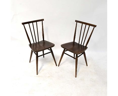 ERCOL; four dark stained stick back dining chairs, with labels (4).