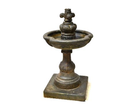 A cast ceramic fountain with piecrust bowl above a baluster column, indistinctly signed and dated 2001, height approx. 134cm