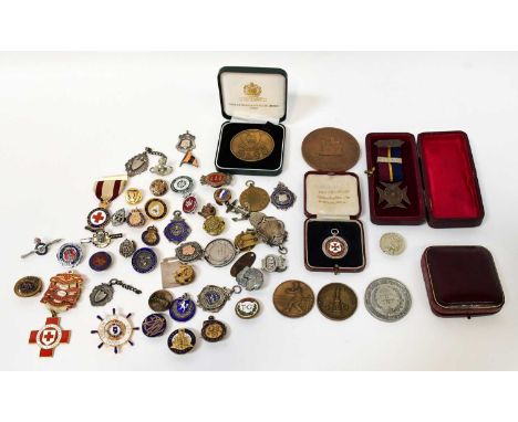 A collection of hallmarked silver and other medallions and badges, including sporting and other examples, Red Cross enamel ba