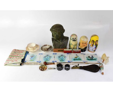 A mixed lot of collectors' items to include three Russian dolls, a leather shot flask, a set of playing cards, an alphabet sa