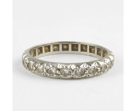 An eternity ring set with tiny diamonds in white metal mount (probably white gold), size N, approx. 3.4g.