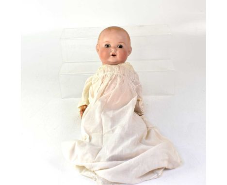 ARMAND MARSEILLE; a bisque headed doll, with open-and-close eyes, open mouth with two teeth, impressed 'A. M. Germany 518./61