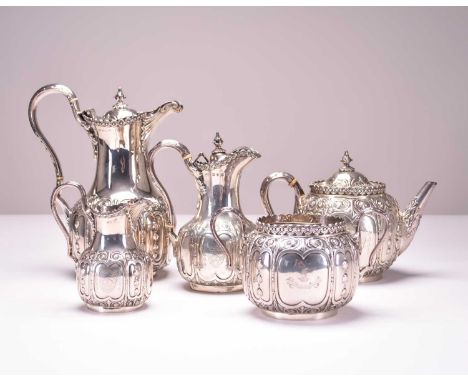 A Victorian matched five piece silver tea service, Roberts & Belk, Sheffield 1860 and 1865, each piece of circular form with 