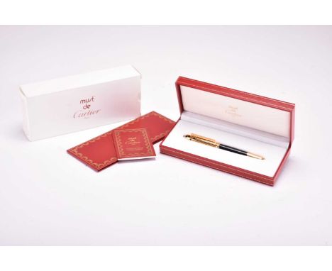 A Cartier Panthere fountain penGold plated and enamel cap with black lacquer barrel, a simulated cabochon top and bottom, wit