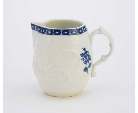 A rare, early Caughley milk jugcirca 1777-82of barrel form with a sparrow beak spout, the strap handle with a scroll terminal