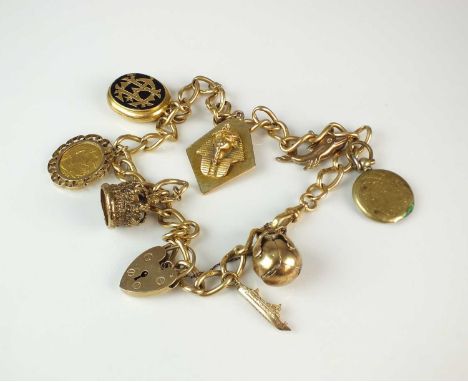 An 18ct gold curb link chain, with swivel clasp and attached charms, charms comprise; a gilt Masonic fob stamped '9ct/Sil', a