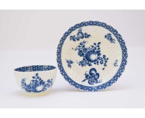 A Caughley 'Apple and Damsons' tea bowl and saucercirca 1780-84of fluted form, transfer-printed in underglaze blue the main p