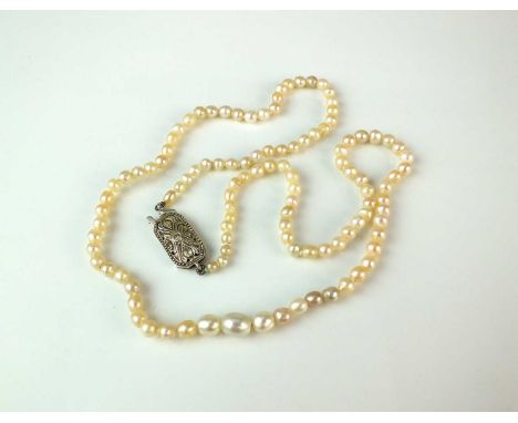 An untested pearl necklace with diamond set clasp, comprising one hundred and eleven untested graduated pearls, all set to wh