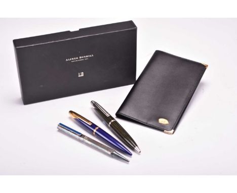 Three Alfred Dunhill ballpoint pensThe first carbon fiber with brushed steel accents, the second lapis finish with gilt accen