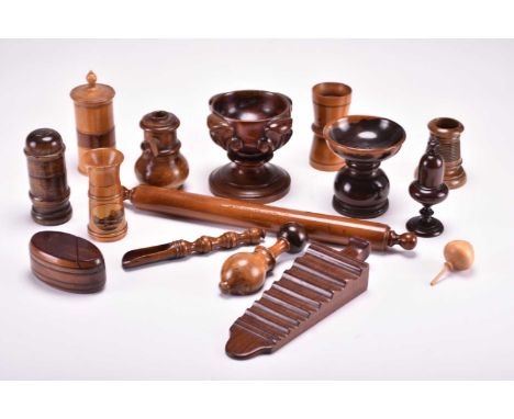 A collection of treen ware, 18th-19th centuryIncluding a rolling pin stamped Robert Coulthard, nutcracker, goblet, marrow sco