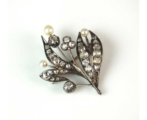 A 19th century diamond and pearl spray brooch, designed as graduated old and rose cut diamonds claw set within a white metal 