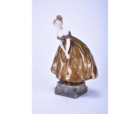 Raphael Nannini (Continental, 19th/20th century), a bronze and ivory figurine of a lady in an off the shoulder evening dress,