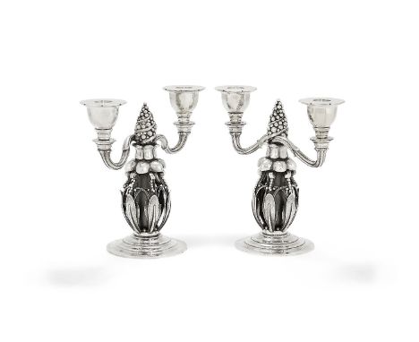 Georg Jensen, a pair of Danish silver Fir Cone twin light candelabra, post 1945 stamped marks, design no. 244, 21cm (8 1/4in)
