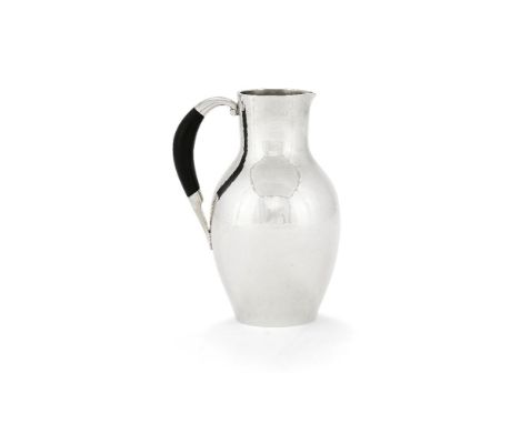 ϒGeorg Jensen, a Danish silver water jug or pitcher, post 1945 stamped marks, design no. 743, designed by Johan Rohde, with a