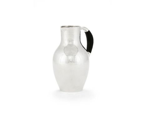 ϒGeorg Jensen, a Danish silver water jug or pitcher, post 1945 stamped marks, design no. 743, designed by Johan Rohde, with a