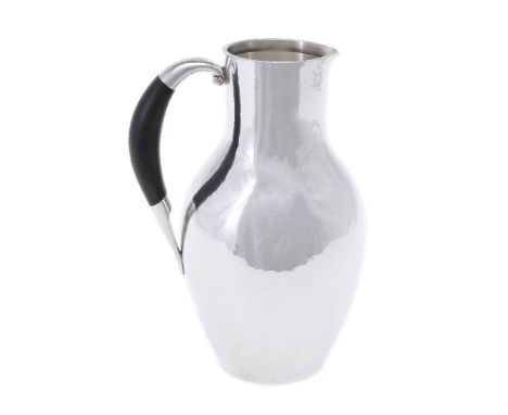 ϒGeorg Jensen, a Danish silver water jug or pitcher, post 1945 stamped marks, design no. 743, designed by Johan Rohde, with a