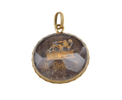 A late Elizabethan memento mori pendant, the woven hairwork panel with a recumbent skeleton upon a pedestal inscribed To Meme