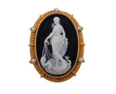 A Victorian hardstone cameo brooch, circa 1860, the oval panel carved with Galatea in light robes standing upon a shell chari