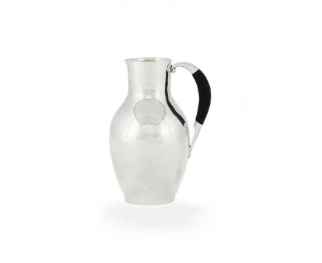 ϒGeorg Jensen, a Danish silver water jug or pitcher, post 1945 stamped marks, design no. 743, designed by Johan Rohde, with a