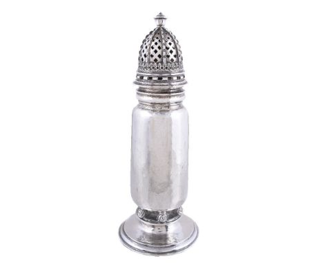An Arts and Crafts hammered silver sugar caster by Omar Ramsden, London 1930, engraved beneath Omar Ramsden Me Fecit, cylindr