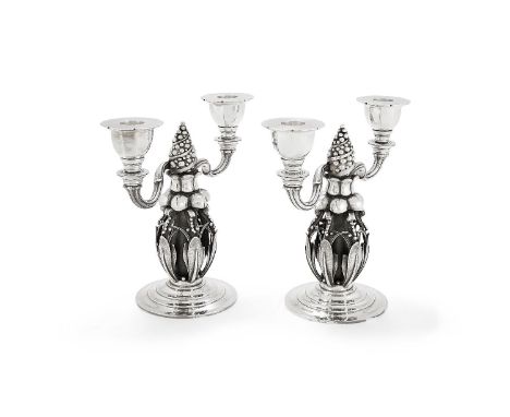 Georg Jensen, a pair of Danish silver Fir Cone twin light candelabra, post 1945 stamped marks, design no. 244, 21cm (8 1/4in)
