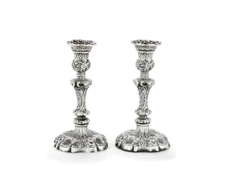 A pair of William IV silver shaped circular candlesticks by John Settle &amp; Henry Wilkinson, Sheffield 1830, embossed overa