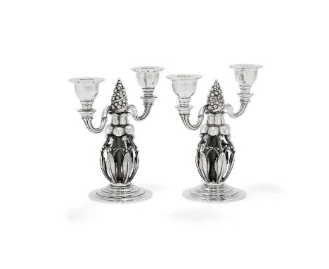 Georg Jensen, a pair of Danish silver Fir Cone twin light candelabra, post 1945 stamped marks, design no. 244, 21cm (8 1/4in)