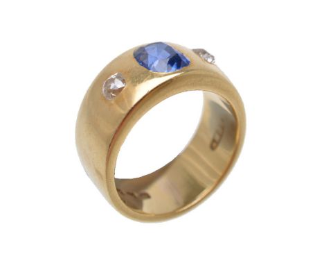 A 1930s 18 carat gold sapphire and diamond three stone ring, the broad shank set with a cushion cut sapphire, estimated to we