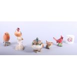 A Royal Worcester porcelain model of a goldfinch, two other Royal Worcester bird models and a Hadley