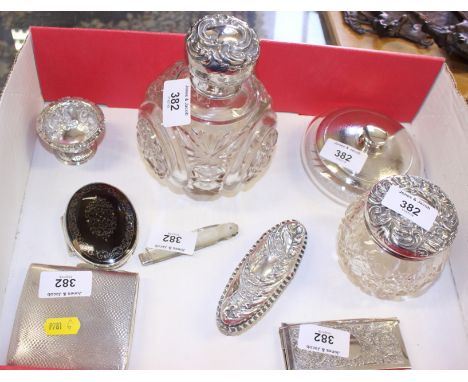 A quantity of silver, including a silver topped grenade-shaped scent bottle, an engine turned cigarette case, a silver topped