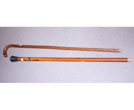 A sword stick, 36" overall, and a silver mounted Malacca cane, 35" long