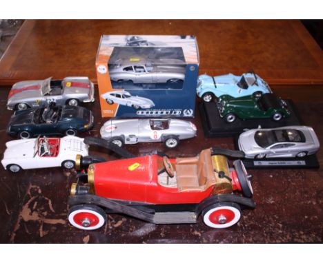 Eight scale models of sports cars, a similar wooden model and a collection of Meccano brochures, Meccano pieces, etc