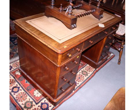 A late Victorian light mahogany double pedestal desk with cream leather insert and nine drawers, 48" x 26 1/2"