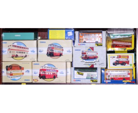 A collection of Corgi die-cast scale models of buses and coaches, in boxes