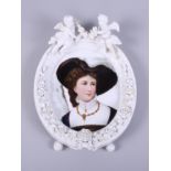 A 19th century German porcelain blanc de chine oval frame, bearing the mark for Helena Wolfsohn,
