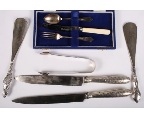 A silver christening knife, fork and spoon set, in case, a pair of silver sugar tongs, two Georgian silver handle knives and 
