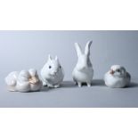 Three Royal Copenhagen porcelain models of a rabbit, a chick and a pair of ducks, and a Berlin