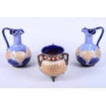 A pair of Royal Doulton stoneware ewers with "C" scroll handles, panels of gilt painted "scale"