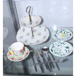 A Midwinter "Capri" cake stand, two Midwinter "Moonflare" green floral saucers, designed by Jessie